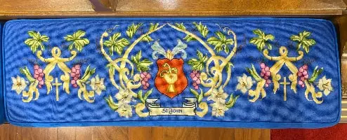 Original kneeler that inspired the linework, grapes, and lilies