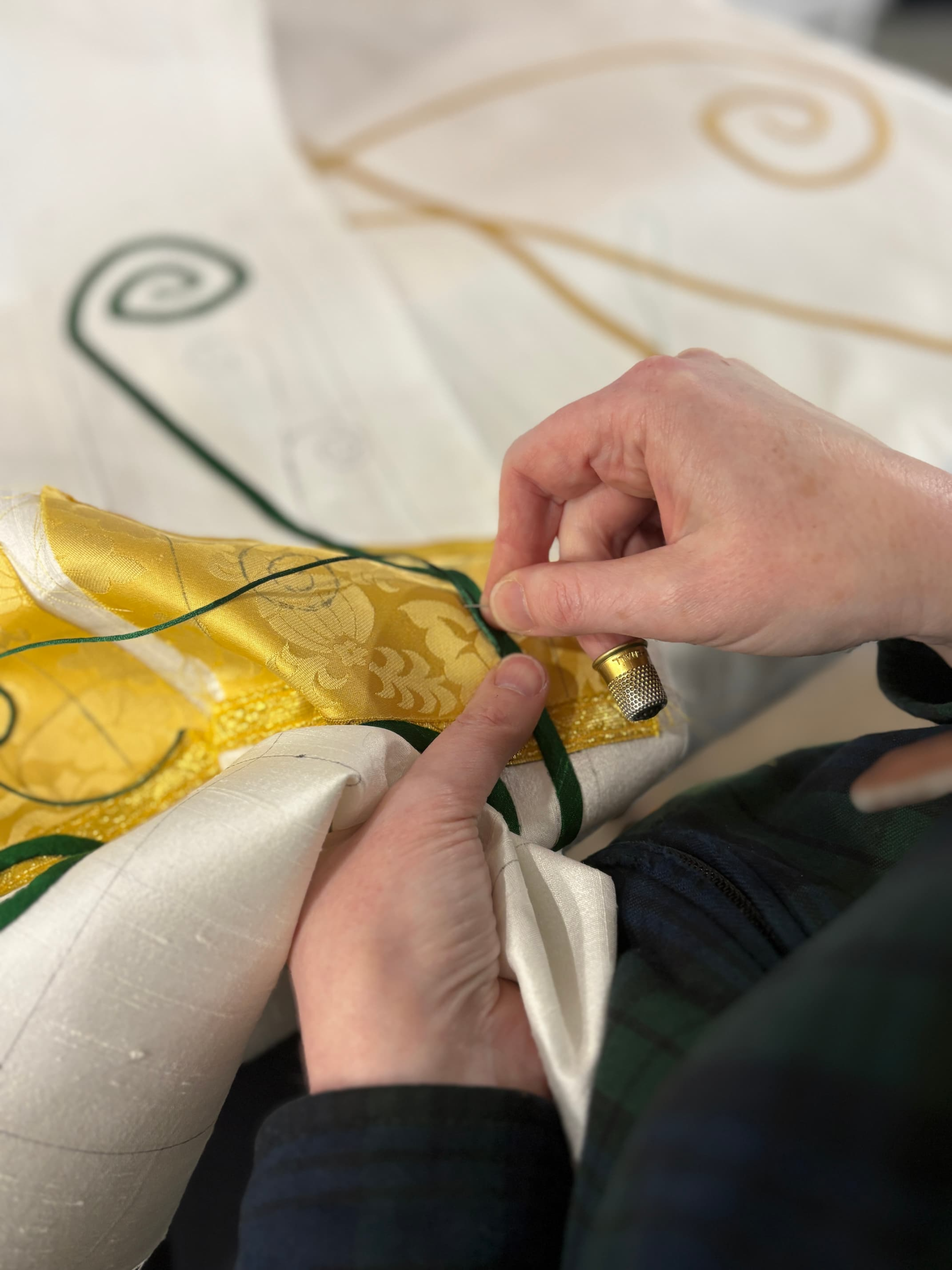 Christina hand-stitching couching to custom paraments