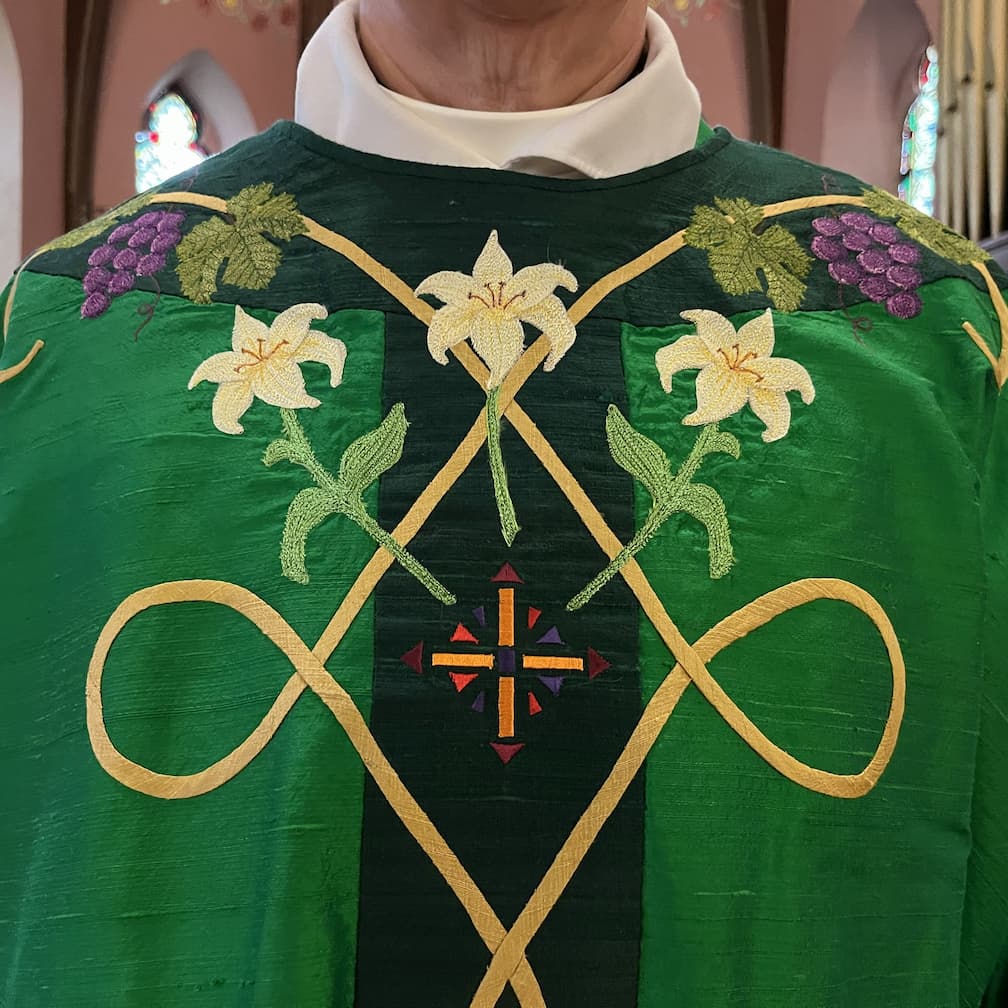 Chasuble detail that echoes the lilies also found in the beloved kneelers at All Saints