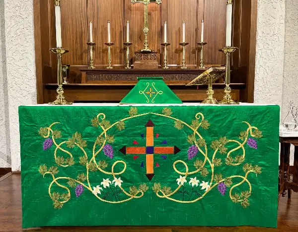 The altar at All Saints in Concord, NC in a rich green palette