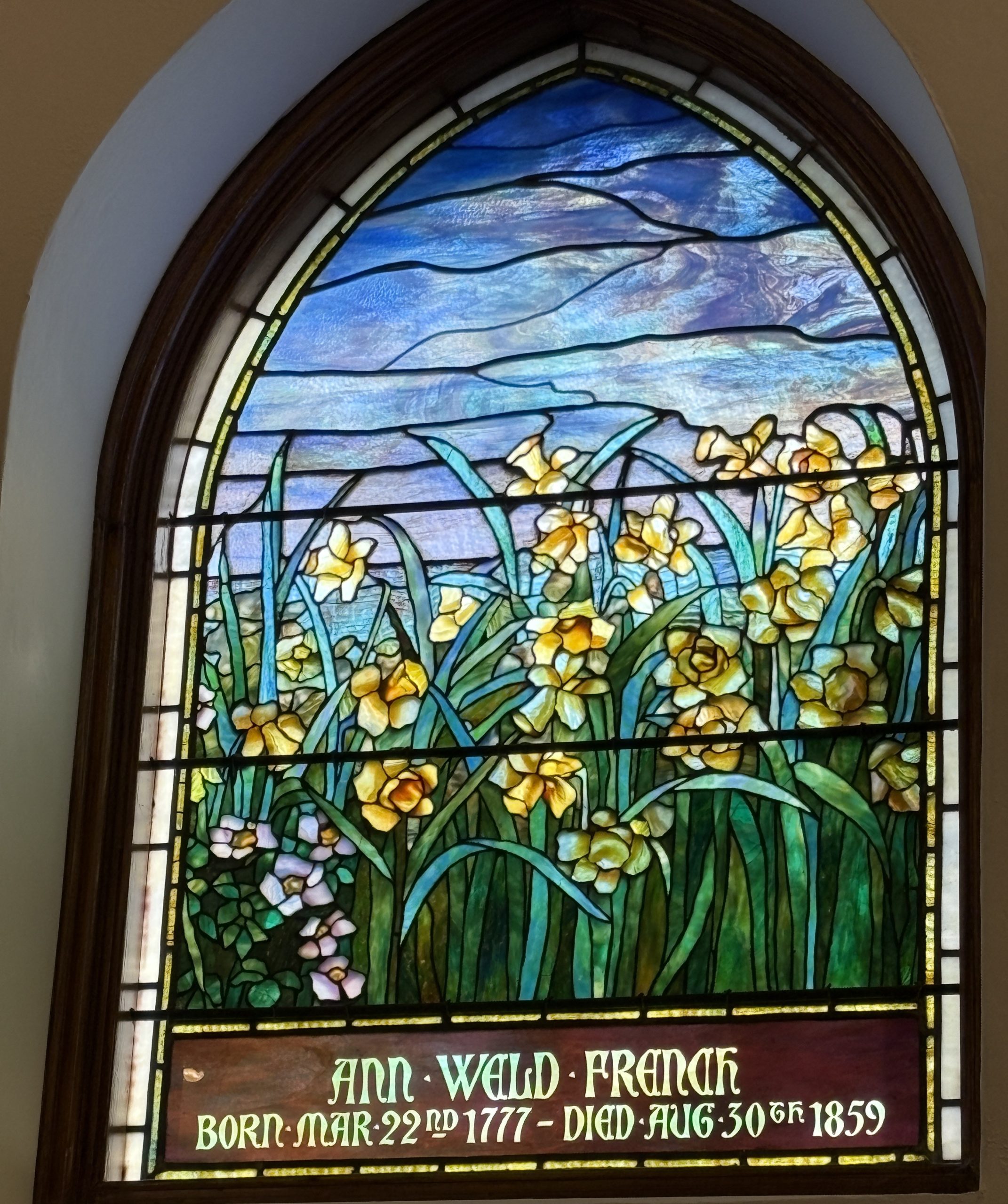 stained glass window detail with yellow flowers