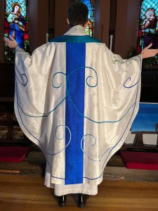 The back of the chasuble continues the linework from the front and paraments