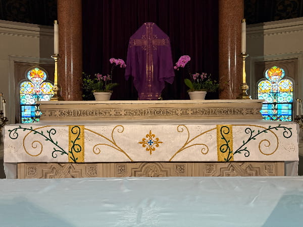 altar frontal with handmade scrollwork and vine motifs for St. Stephen's in Lynn
