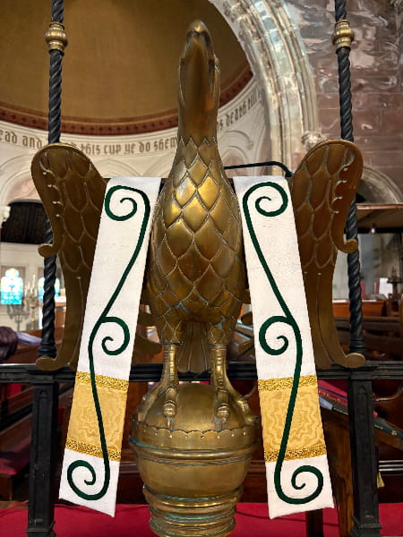 handmade lectern fall with embroidered scrollwork displayed on eagle lectern