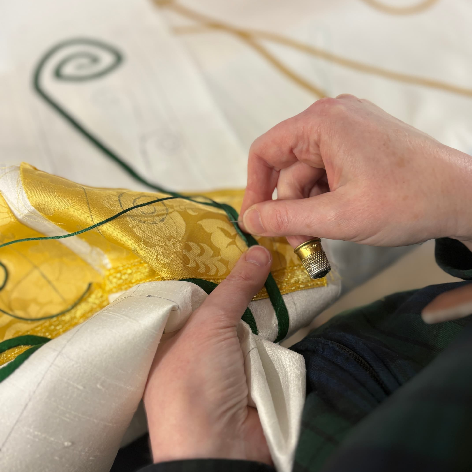 Christina hand-stitching couching to custom paraments