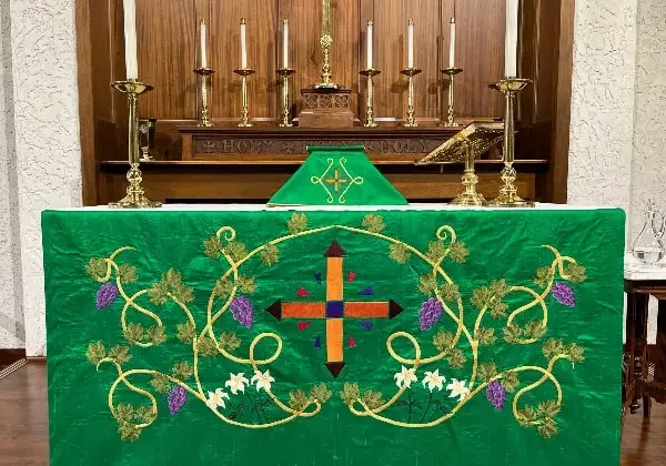 The altar at All Saints in Concord, NC in a rich green palette