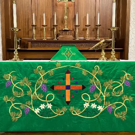 The altar at All Saints in Concord, NC in a rich green palette