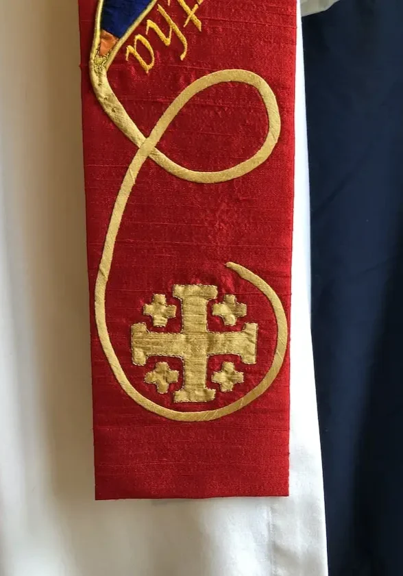 red matriarch clergy stole detail with gold embroidered cross symbol