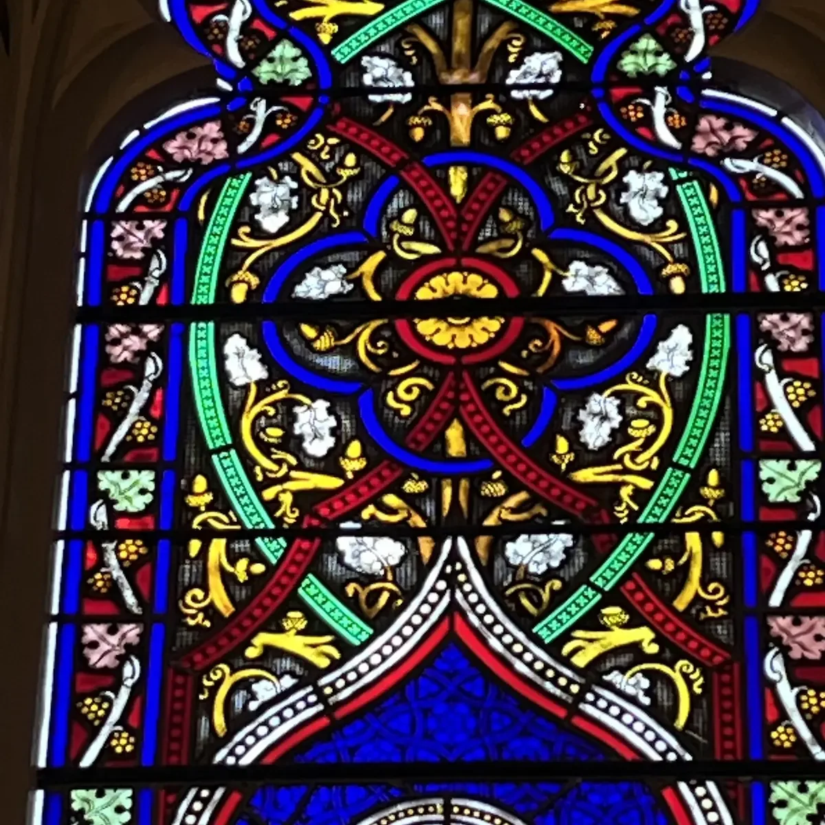 Stained glass window detail that inspired the deep blue shade of the custom paraments