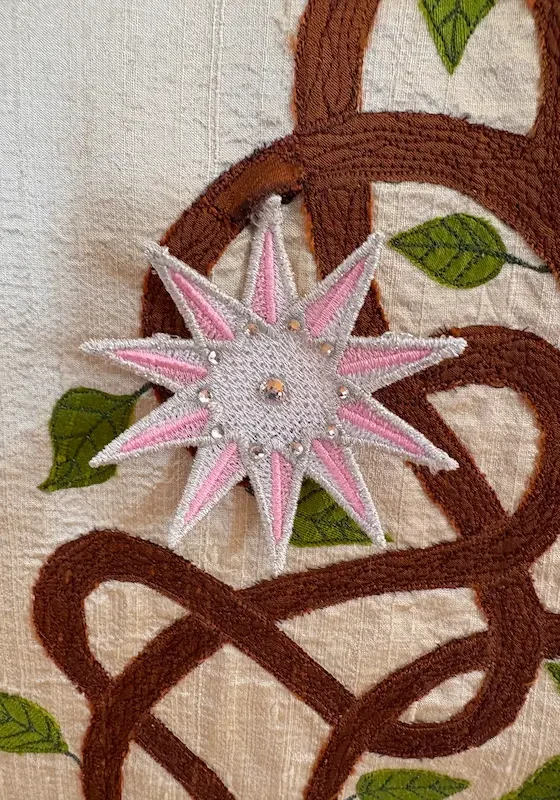 Detail of the applique and handmade pink star for the Sutton Jesse Tree Advent paraments